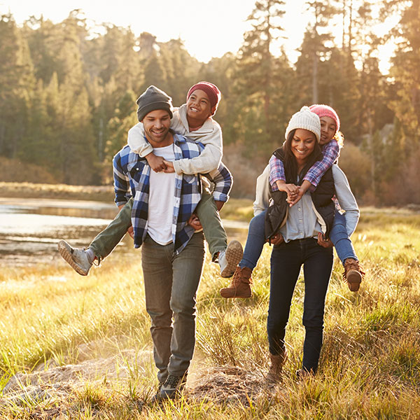 Family of Four hiking by a river